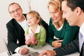 family discussing mortgage loan at bank